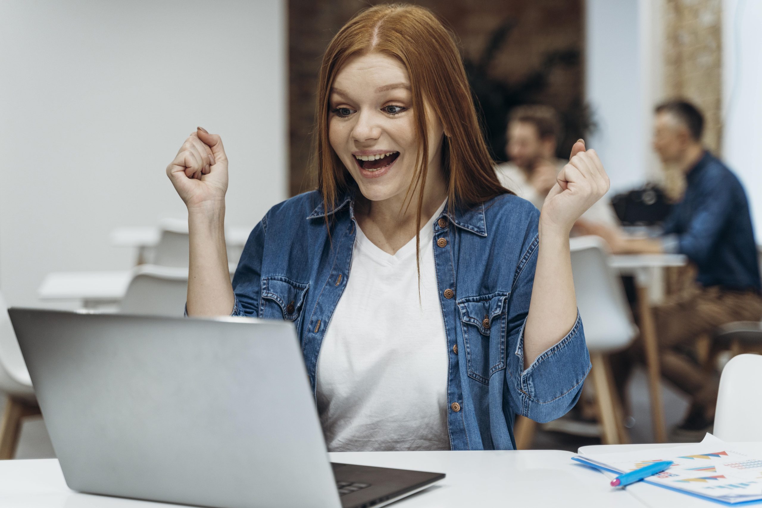 happy-woman-finishing-business-project-min